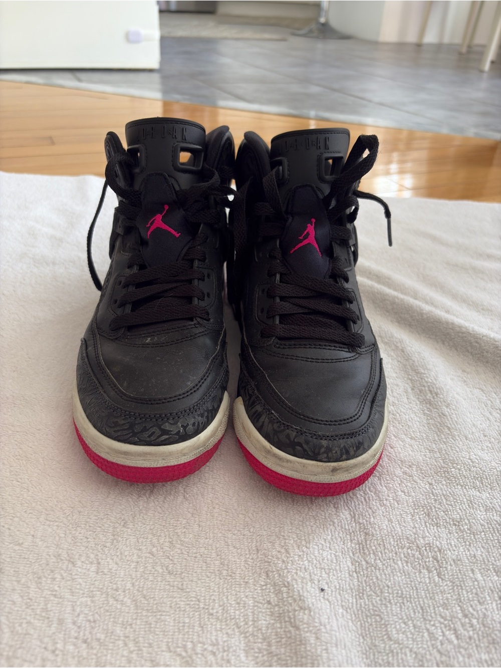 Jordan Black Sneakers with Pink Jumpman Accents